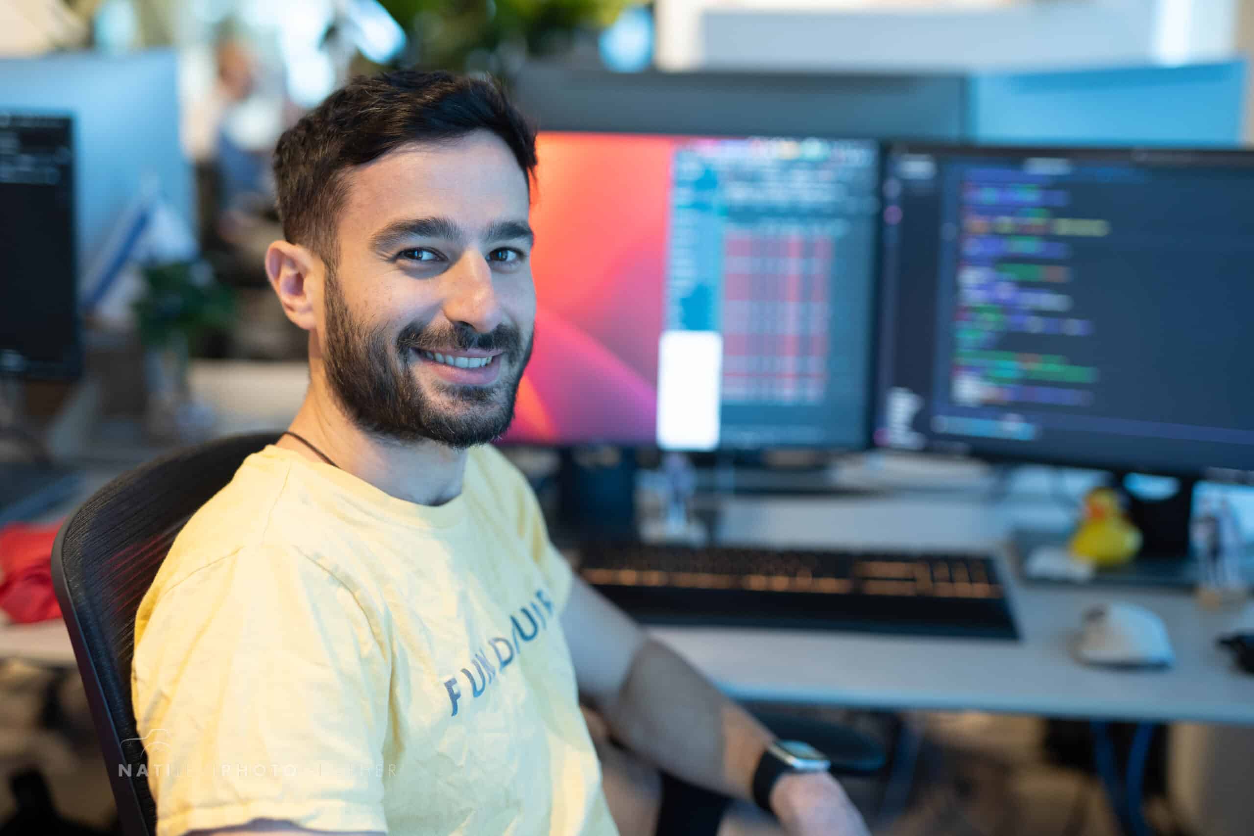 Man at Computer Monitors Working