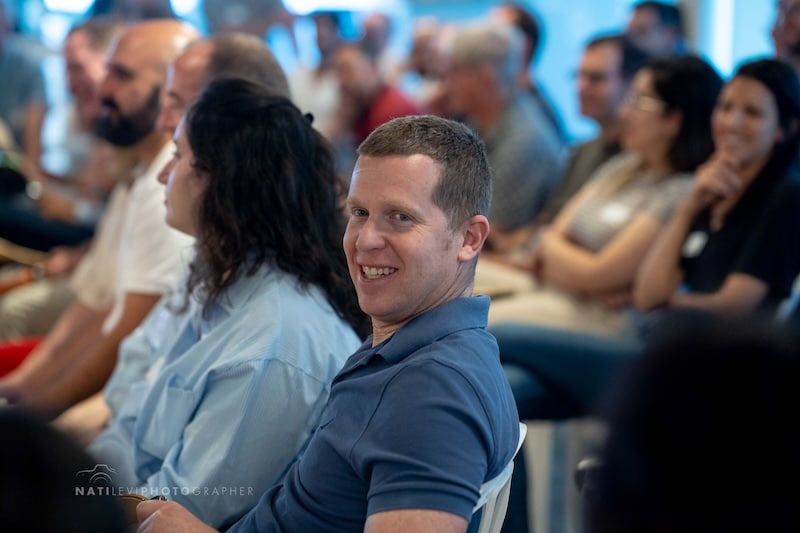photo of a group of people sitting down